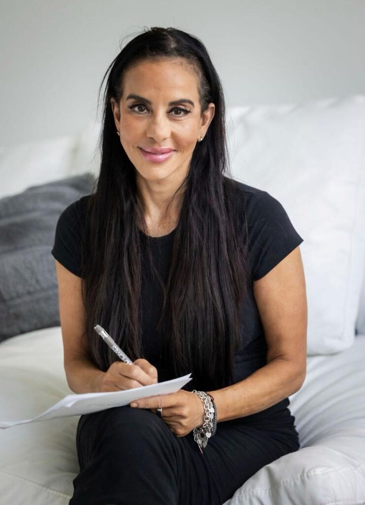 Dr. Manal Michail in a therapy room, providing a calm, curated environment for healing.